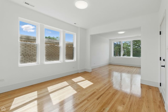 1928 W 21st St, Chicago, IL 60608 - empty room featuring healthy amount of natural light and light wood finished floors