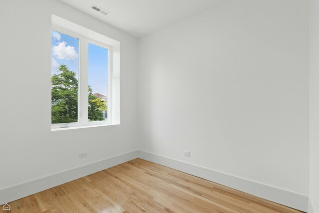1928 W 21st St, Chicago, IL 60608 - spare room featuring baseboards and light wood-type flooring