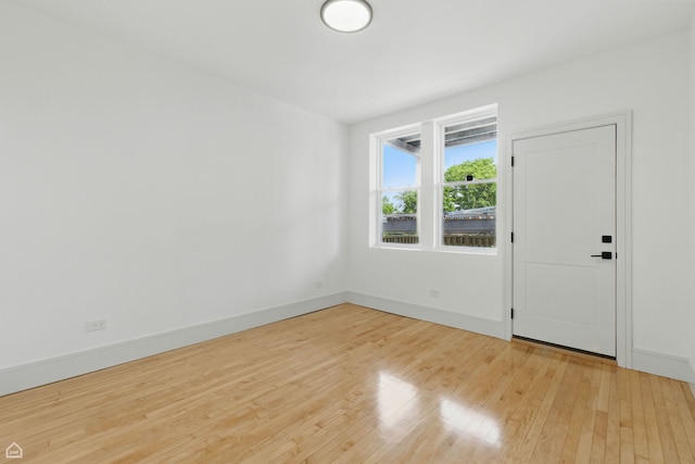 1928 W 21st St, Chicago, IL 60608 - unfurnished room with light wood-style floors and baseboards