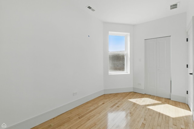 1928 W 21st St, Chicago, IL 60608 - unfurnished bedroom featuring light wood finished floors and baseboards