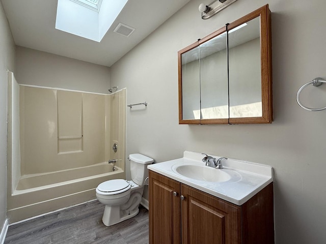 14334 Ridgeway Ave, Midlothian, IL 60445 - full bath featuring a skylight, wood finished floors, vanity, and tub / shower combination