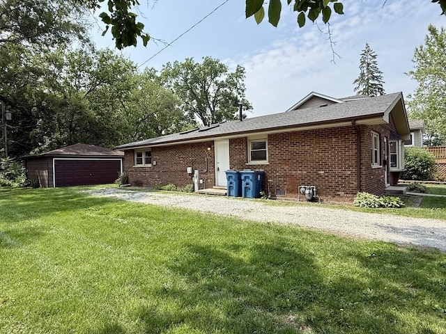 14334 Ridgeway Ave, Midlothian, IL 60445 - back of property featuring a garage, brick siding, a yard, and an outbuilding