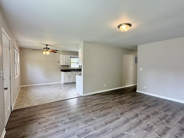14334 Ridgeway Ave, Midlothian, IL 60445 - unfurnished living room featuring dark wood-style floors and ceiling fan