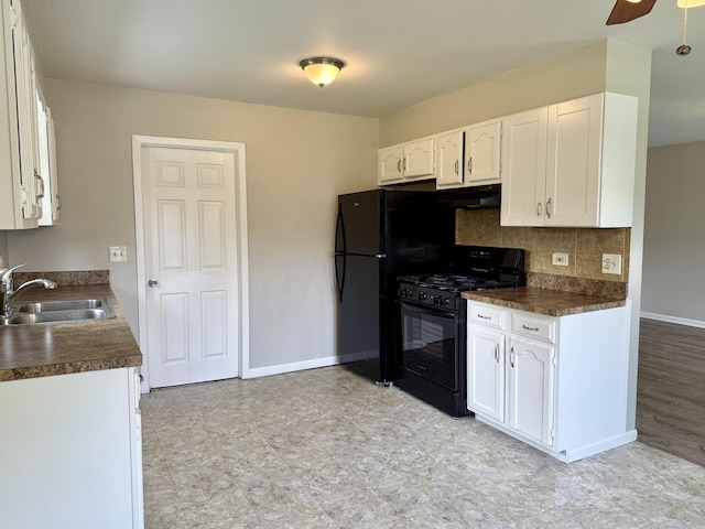 14334 Ridgeway Ave, Midlothian, IL 60445 - kitchen featuring black gas stove, dark countertops, white cabinets, decorative backsplash, and range hood