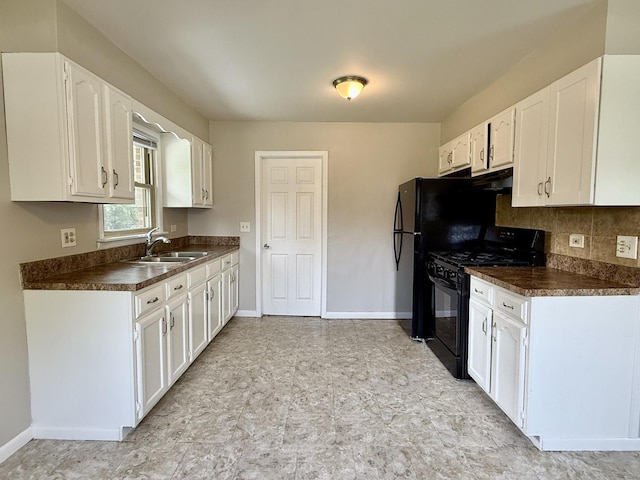14334 Ridgeway Ave, Midlothian, IL 60445 - kitchen featuring gas stove, dark countertops, white cabinets, and backsplash