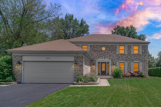 4227 N Walnut Ave, Arlington Heights, IL 60004 - view of front of property with driveway, brick siding, a yard, and an attached garage