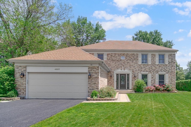4227 N Walnut Ave, Arlington Heights, IL 60004 - view of front of property with driveway, brick siding, a front yard, an attached garage, and roof with shingles