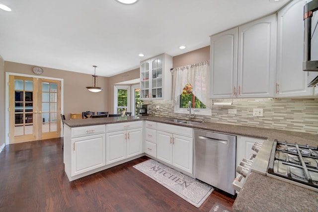 4227 N Walnut Ave, Arlington Heights, IL 60004 - kitchen featuring stainless steel dishwasher, french doors, a peninsula, dark wood-type flooring, and decorative backsplash