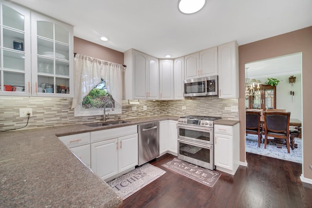 4227 N Walnut Ave, Arlington Heights, IL 60004 - kitchen with stainless steel appliances, dark wood-style flooring, white cabinetry, decorative backsplash, and recessed lighting