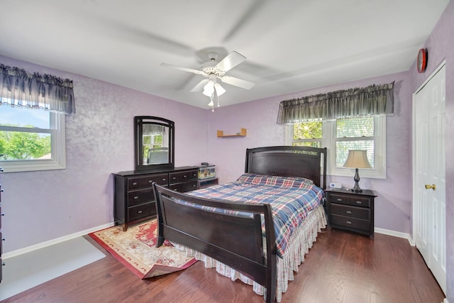 4227 N Walnut Ave, Arlington Heights, IL 60004 - bedroom with multiple windows, dark wood finished floors, a closet, and ceiling fan