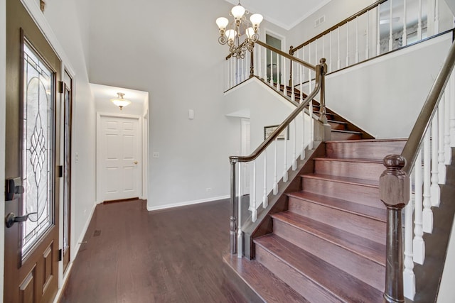 4227 N Walnut Ave, Arlington Heights, IL 60004 - foyer entrance with stairway, wood finished floors, a chandelier, a high ceiling, and crown molding