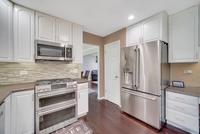 4227 N Walnut Ave, Arlington Heights, IL 60004 - kitchen featuring appliances with stainless steel finishes, dark wood-style flooring, backsplash, white cabinets, and recessed lighting