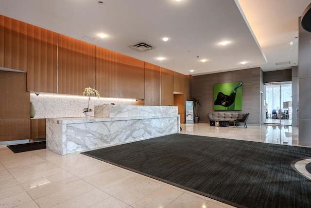 225 N Columbus Dr Unit 8008, Chicago, IL 60601 - reception featuring wooden walls and recessed lighting