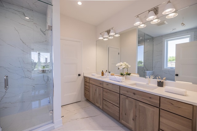 1016 N Hermitage Ave Unit 1, Chicago, IL 60622 - full bath with marble finish flooring, a marble finish shower, double vanity, a chandelier, and recessed lighting