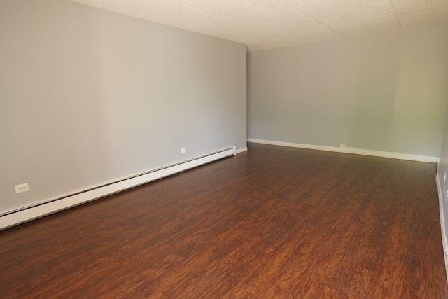 4410 W 111th St Unit 201, Oak Lawn, IL 60453 - empty room featuring dark wood-style flooring, a baseboard heating unit, and baseboards
