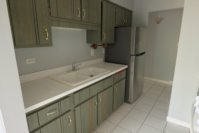 4410 W 111th St Unit 201, Oak Lawn, IL 60453 - kitchen with a sink, light tile patterned floors, light countertops, freestanding refrigerator, and baseboards