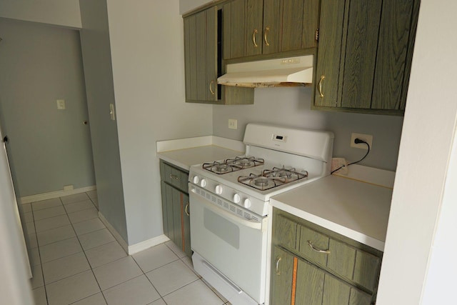 4410 W 111th St Unit 201, Oak Lawn, IL 60453 - kitchen featuring white gas range, under cabinet range hood, light tile patterned flooring, light countertops, and baseboards