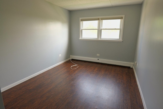 4410 W 111th St Unit 201, Oak Lawn, IL 60453 - spare room with a baseboard heating unit, wood finished floors, and baseboards