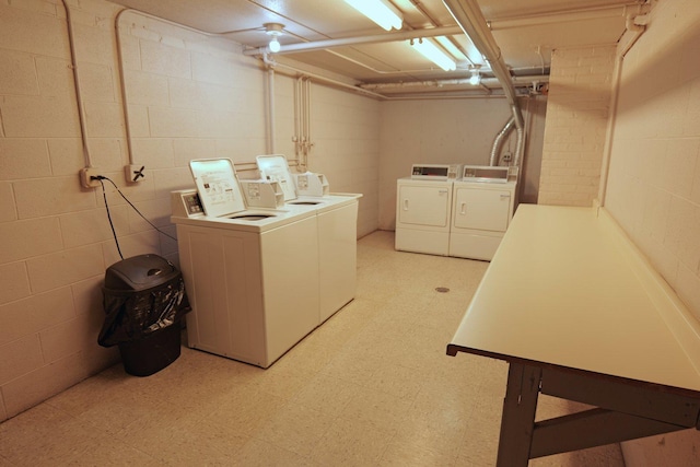 4410 W 111th St Unit 201, Oak Lawn, IL 60453 - communal laundry room featuring separate washer and dryer, light floors, and concrete block wall