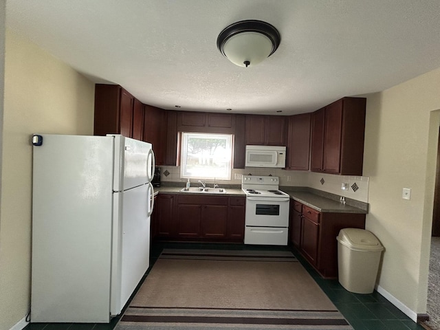 2100 Steven St, Rock Falls, IL 61071 - kitchen featuring white appliances, a sink, and baseboards