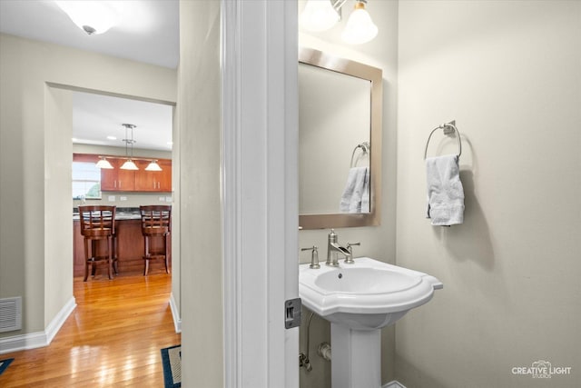 431 Blue Ridge Ct, Oswego, IL 60543 - bathroom featuring wood finished floors and baseboards