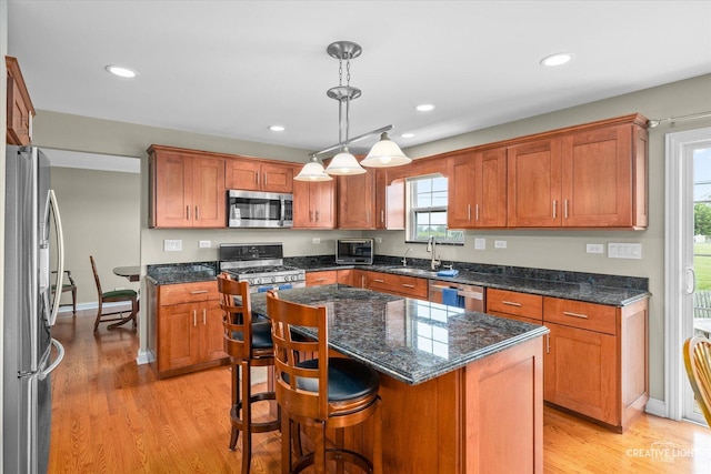 431 Blue Ridge Ct, Oswego, IL 60543 - kitchen featuring appliances with stainless steel finishes, healthy amount of natural light, light wood-style floors, and recessed lighting