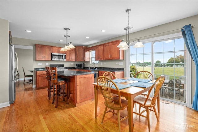 431 Blue Ridge Ct, Oswego, IL 60543 - dining space with light wood-style floors and recessed lighting