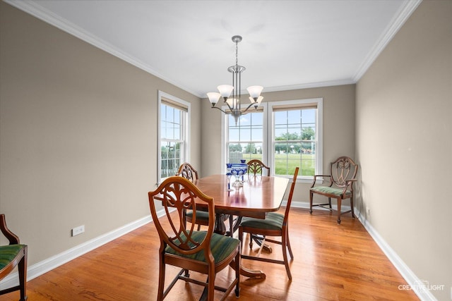 431 Blue Ridge Ct, Oswego, IL 60543 - dining space with a chandelier, crown molding, and light wood-type flooring