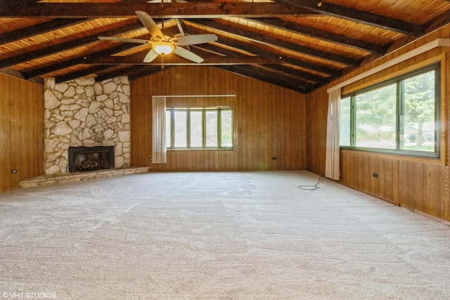 509 Sherman Ave, Aurora, IL 60505 - unfurnished living room featuring wooden ceiling, wood walls, carpet floors, ceiling fan, and a fireplace