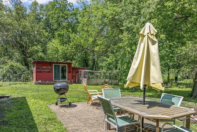 1046 N Riverside Dr, Momence, IL 60954 - view of patio featuring outdoor dining area, area for grilling, and an outdoor structure