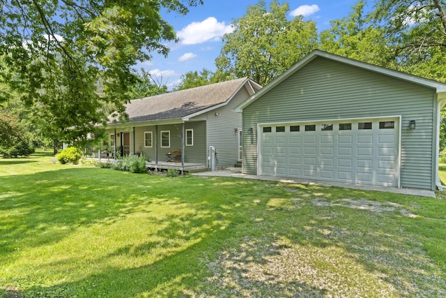 1046 N Riverside Dr, Momence, IL 60954 - view of front facade featuring a front yard, a shingled roof, and a garage