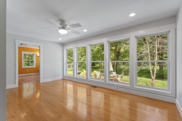 1046 N Riverside Dr, Momence, IL 60954 - unfurnished room featuring plenty of natural light, ceiling fan, light wood finished floors, and recessed lighting