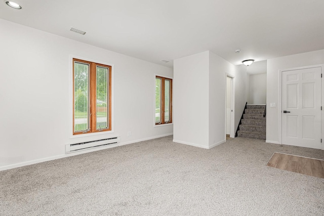 1500 Bunescu Ln, Buffalo Grove, IL 60089 - carpeted empty room featuring a baseboard radiator, stairway, baseboards, and recessed lighting