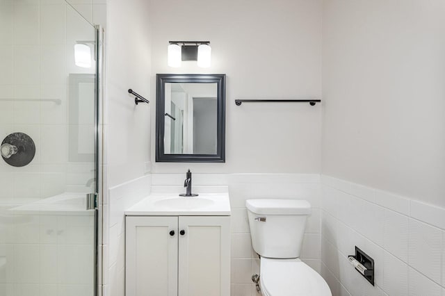1500 Bunescu Ln, Buffalo Grove, IL 60089 - full bath featuring a stall shower, vanity, toilet, tile walls, and a wainscoted wall