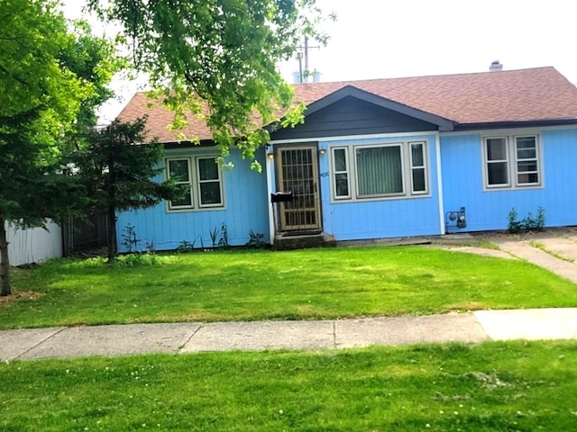 4930 S Luna Ave, Chicago, IL 60638 - ranch-style home with a front yard and roof with shingles