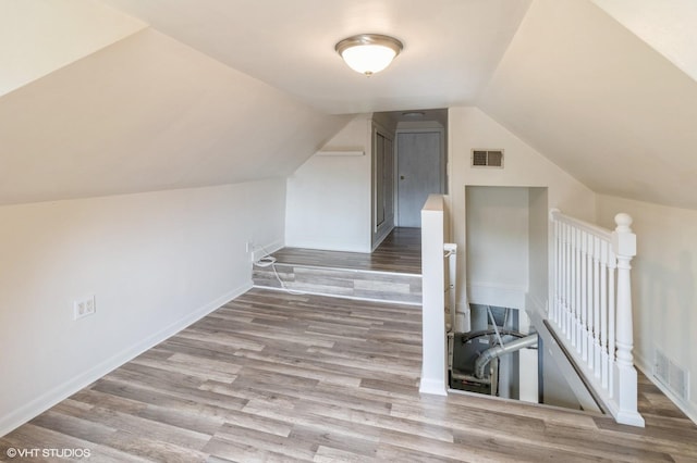 1678 Pratt Ave, Des Plaines, IL 60018 - bonus room featuring wood finished floors, lofted ceiling, and baseboards
