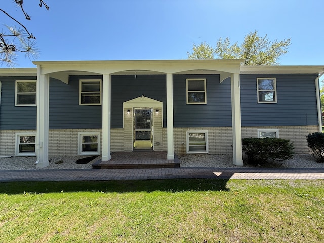 11 S Roberts Rd, Inverness, IL 60067 - raised ranch featuring a front yard and covered porch