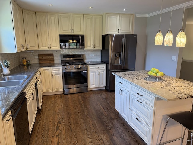 11 S Roberts Rd, Inverness, IL 60067 - kitchen with appliances with stainless steel finishes, a sink, dark wood-type flooring, decorative backsplash, and stone countertops