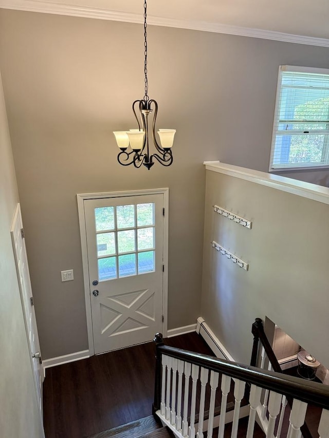 11 S Roberts Rd, Inverness, IL 60067 - entryway with dark wood-style flooring, a chandelier, crown molding, and baseboards