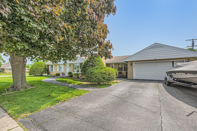 9001 Mobile Ave, Oak Lawn, IL 60453 - view of front of home featuring brick siding, a front yard, driveway, and a garage