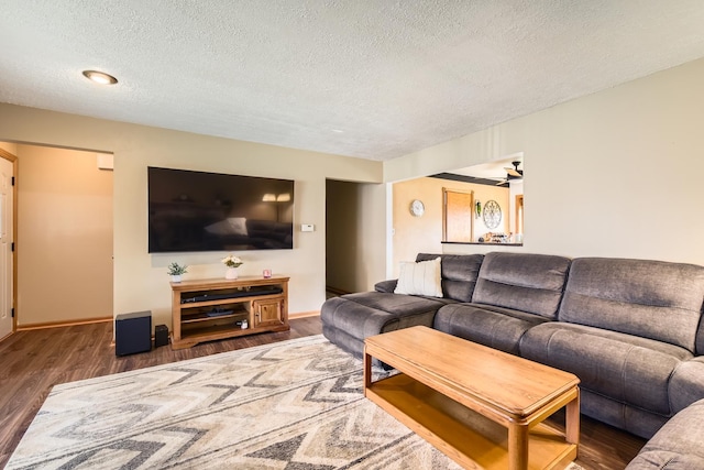 9001 Mobile Ave, Oak Lawn, IL 60453 - living room featuring a textured ceiling and wood finished floors