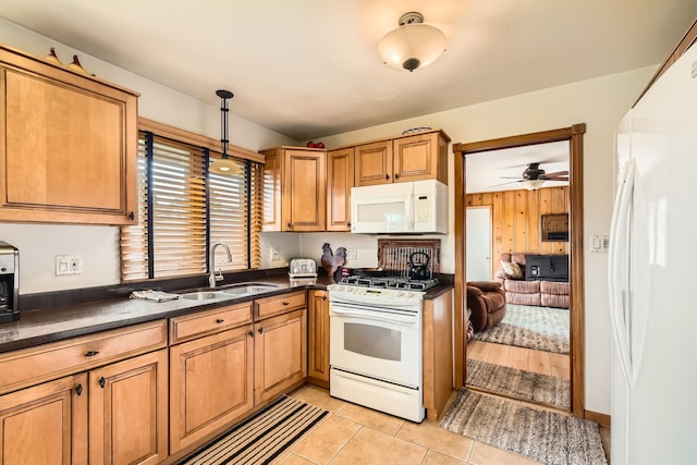 9001 Mobile Ave, Oak Lawn, IL 60453 - kitchen featuring white appliances, dark countertops, hanging light fixtures, light tile patterned flooring, and a ceiling fan