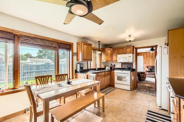 9001 Mobile Ave, Oak Lawn, IL 60453 - kitchen featuring white appliances, ceiling fan, dark countertops, and light tile patterned flooring