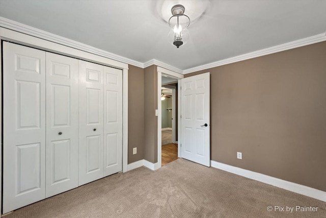 5502 Thelen Ave, Mchenry, IL 60050 - unfurnished bedroom featuring light carpet, a closet, and crown molding