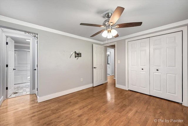 5502 Thelen Ave, Mchenry, IL 60050 - unfurnished bedroom with crown molding, light wood finished floors, a closet, a ceiling fan, and ensuite bathroom