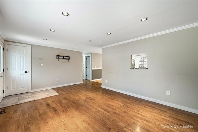 5502 Thelen Ave, Mchenry, IL 60050 - spare room featuring crown molding, recessed lighting, and wood finished floors