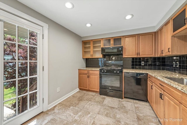5502 Thelen Ave, Mchenry, IL 60050 - kitchen with black appliances, decorative backsplash, light stone counters, recessed lighting, and glass insert cabinets