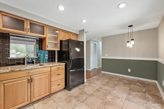 5502 Thelen Ave, Mchenry, IL 60050 - kitchen with freestanding refrigerator, tasteful backsplash, light stone counters, hanging light fixtures, and recessed lighting