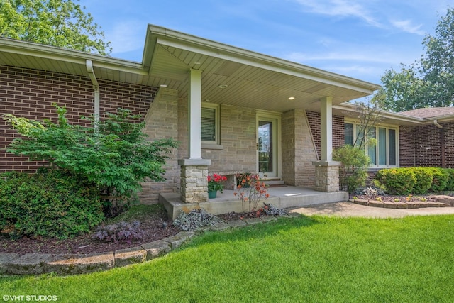 10901 W 131st St, Orland Park, IL 60467 - property entrance featuring covered porch, a lawn, brick siding, and stone siding