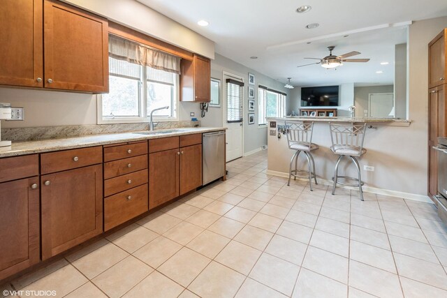 10901 W 131st St, Orland Park, IL 60467 - kitchen featuring dishwasher, brown cabinetry, a ceiling fan, plenty of natural light, and recessed lighting